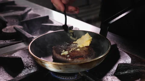 Beef steak fried in butter - close-up Stock Footage 152771270