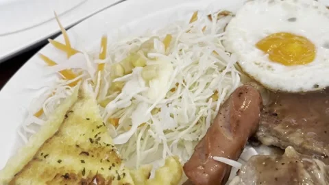 Beef Steak with Fried Egg Sausage and French Fries Stock Footage 342667311