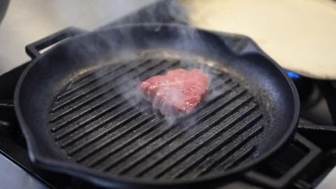  Beef Steak Is Fried On A Grill Pan Stock Footage 83587476