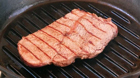 Beef steak frying in UHD Video stock 151898690