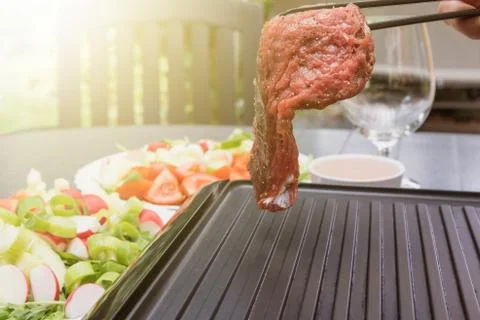 Beef steak is given on the grill Stock Photos