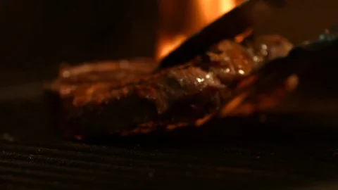 Beef Steak On A Grill In A Fire. Closeup Stock Footage 82670753