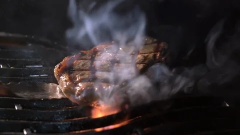 Beef steak on the grill with flames Stock Footage 101799796