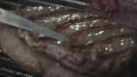 Beef Steak on Grill Stock Footage 135644175