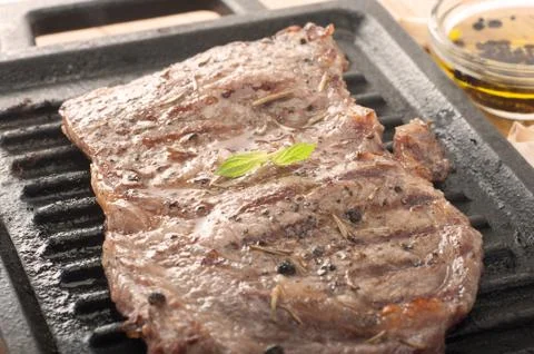 Beef steak on grill Stock Photos