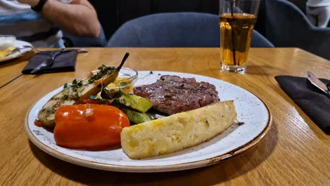 Beef steak with grilled vegetables close-up. Restaurant Stock Footage 246587990