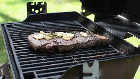 Beef steak grilling Stock Footage 137134232