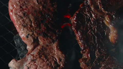 Beef steak grilling at night Stock Footage 315414223