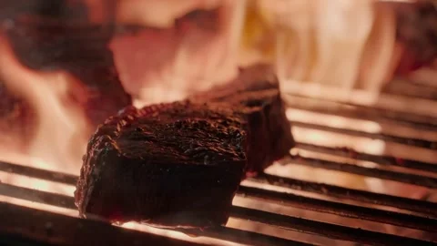 Beef Steak Grilling Over Open Flames on Barbecue Stock Footage 346470212