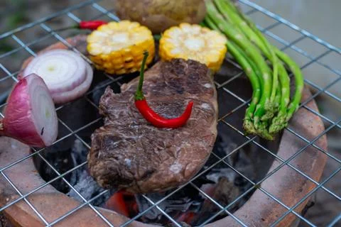 Beef steak grilling Stock Photos