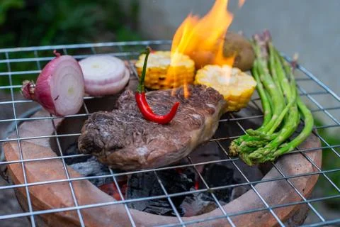Beef steak grilling Stock Photos