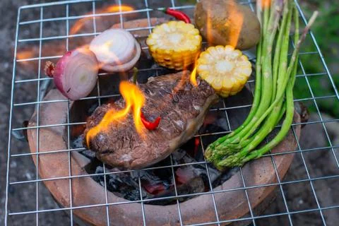 Beef steak grilling Stock Photos