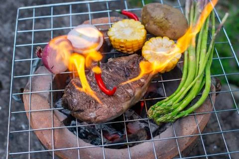 Beef steak grilling Stock Photos