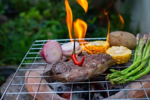 Beef steak grilling Stock Photos