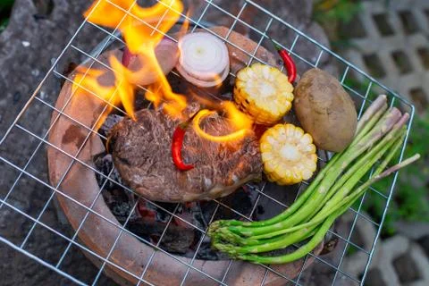 Beef steak grilling Stock Photos