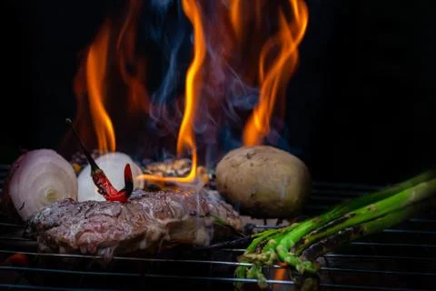 Beef steak grilling Stock Photos