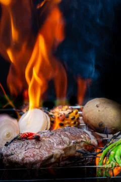 Beef steak grilling Stock Photos