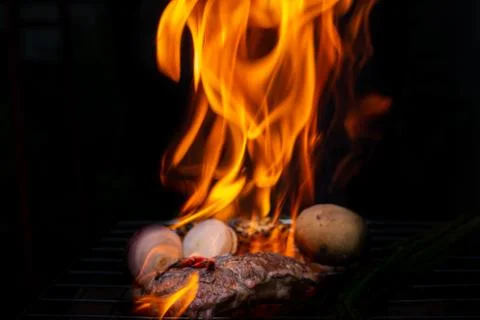 Beef steak grilling Stock Photos