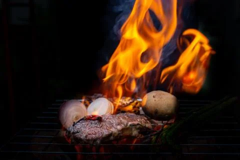 Beef steak grilling Stock Photos