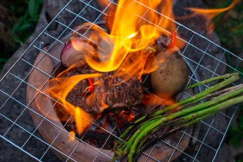 Beef steak grilling Stock Photos