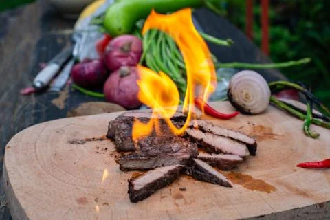 Beef steak grilling Stock Photos