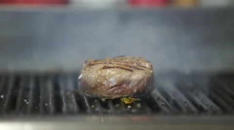Beef steak is grilling at restaurant kitchen Stock Footage 61895970