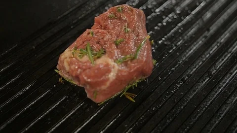 Beef steak is grilling at restaurant kitchen Video stock 75410775
