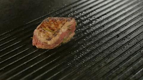 Beef steak is grilling at restaurant kitchen Stock Footage 75411405