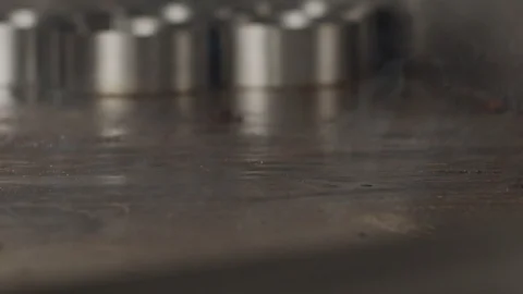 Beef steak in motion falls on the electric stove. Slow motion video Stock Footage 116241286
