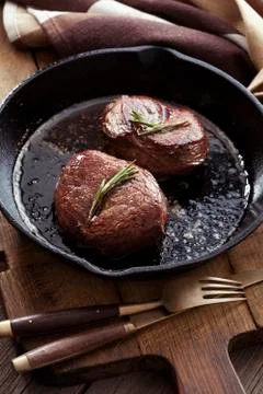 Beef steak in pan Stock Photos