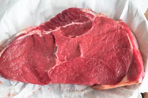 Beef steak on the papper close up Stock Photos