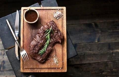 Beef steak. Piece of Grilled BBQ beef in spices Stock Photos