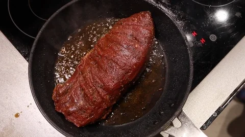 Beef steak roast in pan Stock-Footage 115287446