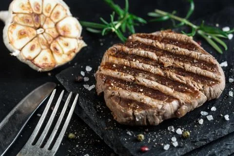 Beef steak with spices Stock Photos