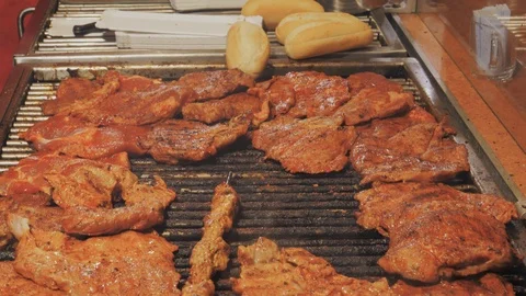 Beef steaks and kebab roasting on grill. Street fast food Stock Footage 98424368