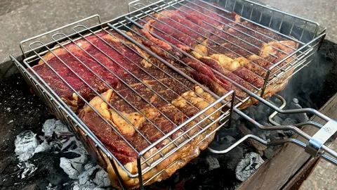 Beef steaks are grilled on the grill. Stock Footage 310652738
