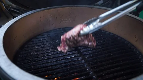 Beef steaks on the grill with flames Stock Footage 128985466