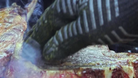 Beef steaks on the grill with flames Video stock 250157935