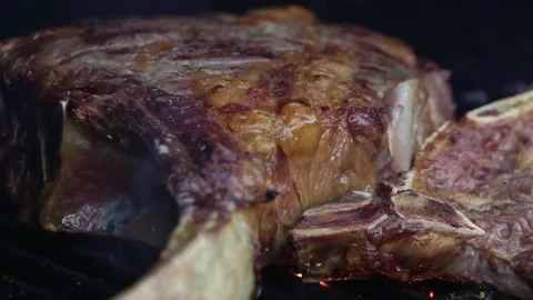 Beef steaks on the grill with flames Video stock 250157963