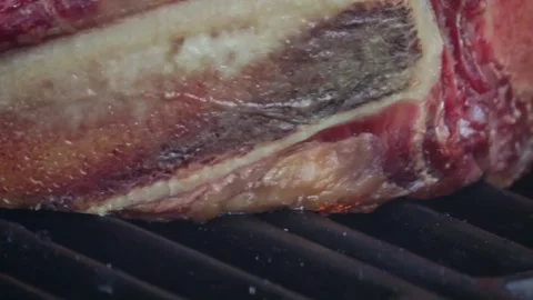 Beef steaks on the grill with flames Stock Footage 250157984