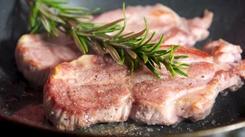 Beef steaks on the grill with flames grilled beef steaks with spices isolated Stock Footage 242788797