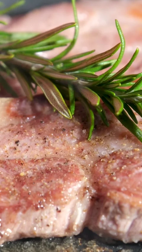 Beef steaks on the grill with flames grilled beef steaks with spices isolated Stock Footage 244978172