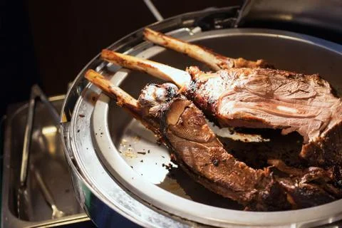 Beef steaks on the grill with flames 库存照片