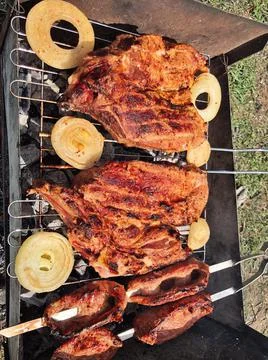Beef steaks on the grill with flames Foto stock