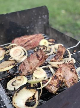 Beef steaks on the grill with flames Foto stock