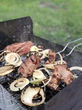 Beef steaks on the grill with flames Stock Photos