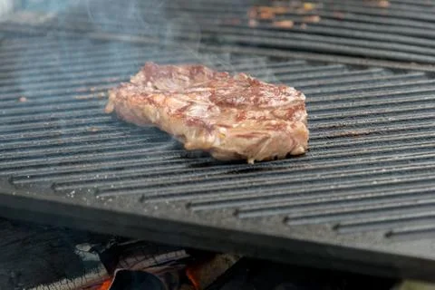 Beef steaks on the grill Stock Photos
