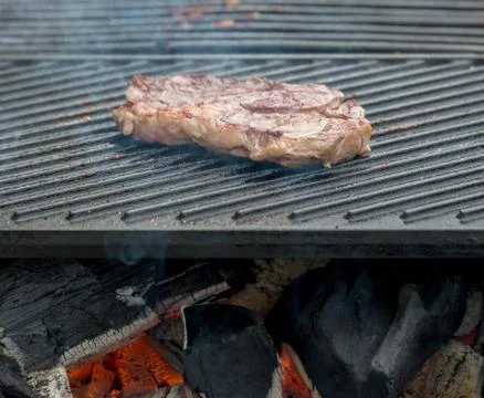 Beef steaks on the grill Stock Photos