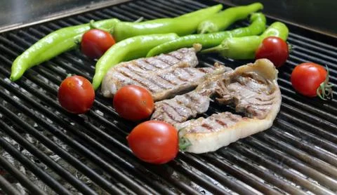 Beef Steaks on the Grill with Vegetables Photos