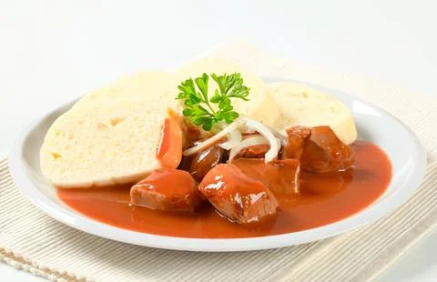 Beef stew with bread and parsley garnish Fotos Stock